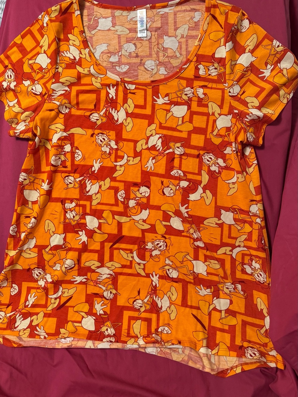 LuLaRoe Bright Orange Cartoon Print Top